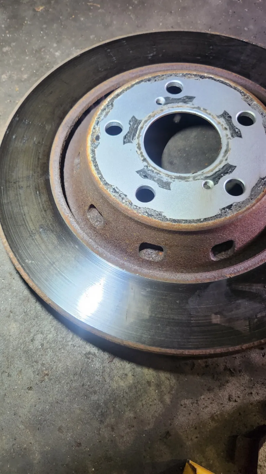 Worn brake rotor assessed in the Top Gear Auto shop