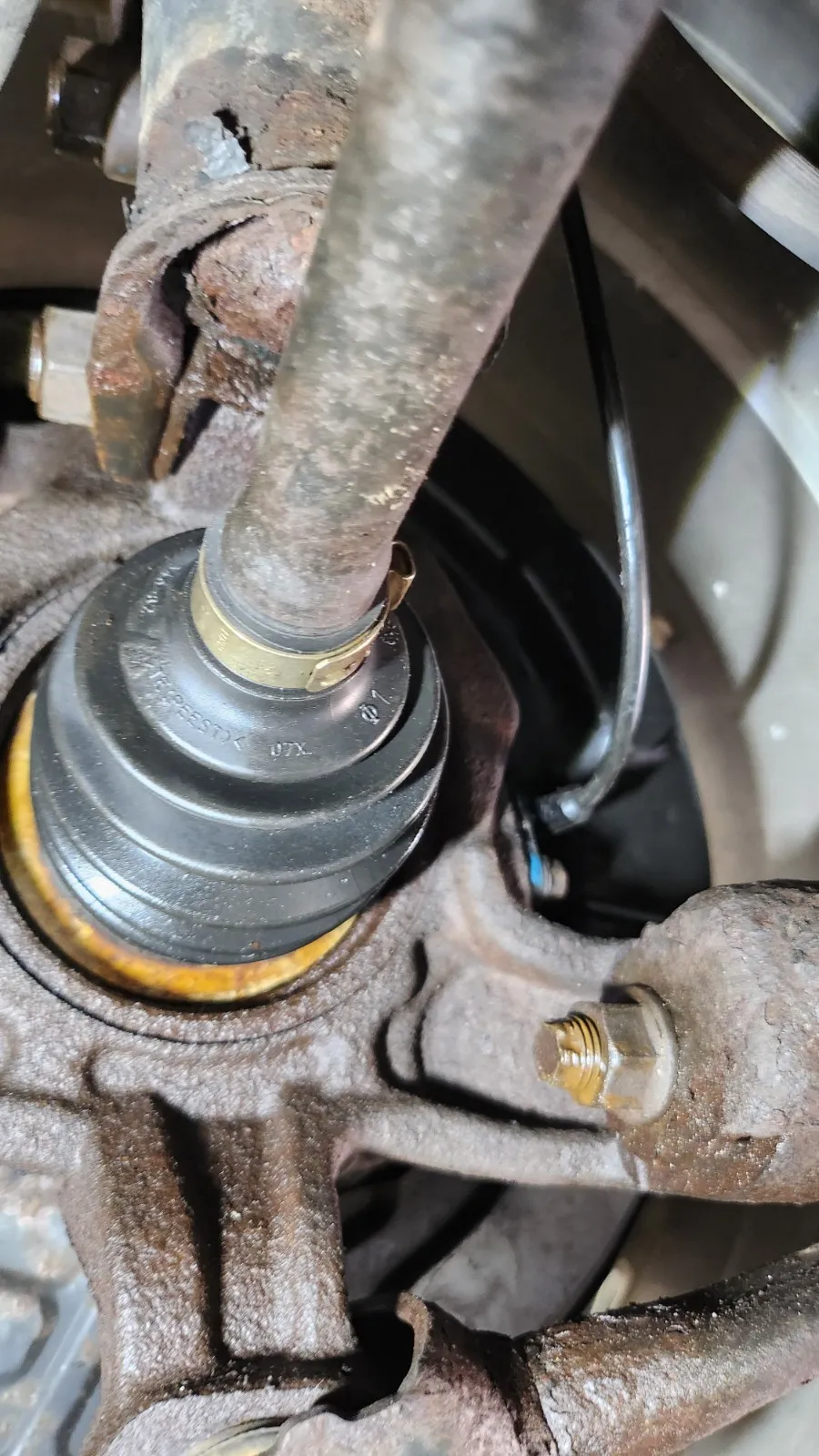 Worn suspension ball joint inspected in the Top Gear Auto shop