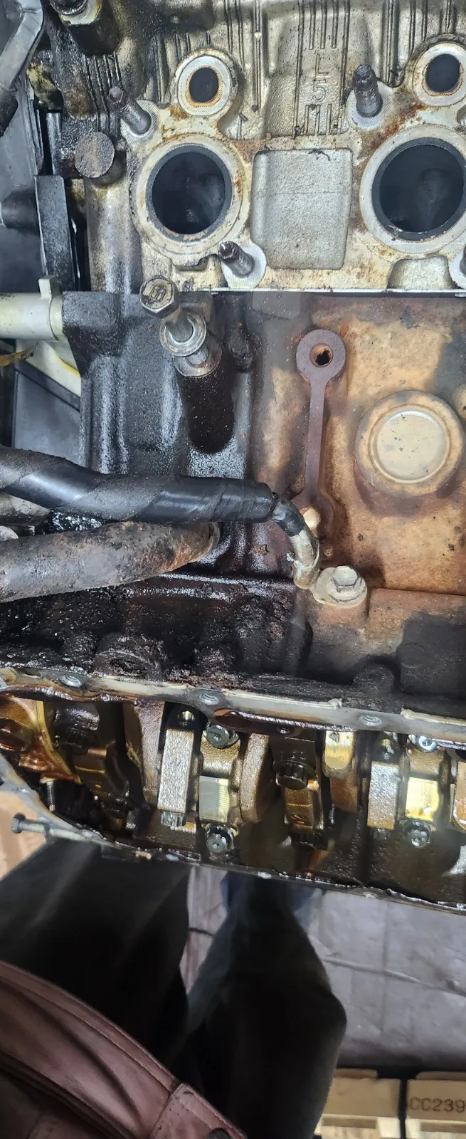 Close inspection of a worn suspension seal in the Top Gear Auto shop